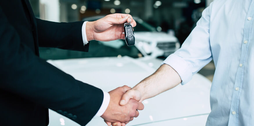 Men Shaking Hands, One Man Receiving Car Keys